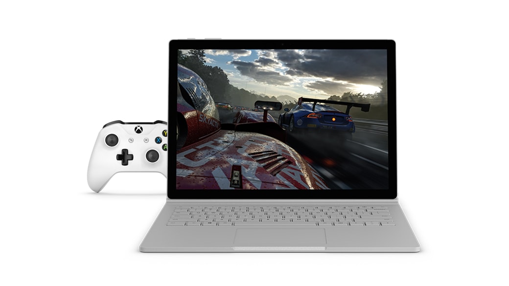 Surface Book 2 running video game, Xbox One S controller behind on the left.