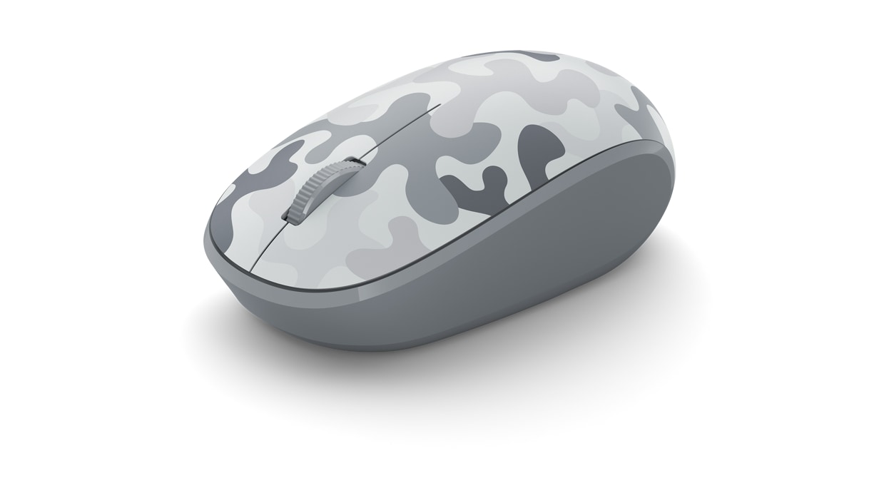 Angled view of Arctic Camo mouse highlighting thumb contour and finger dial.